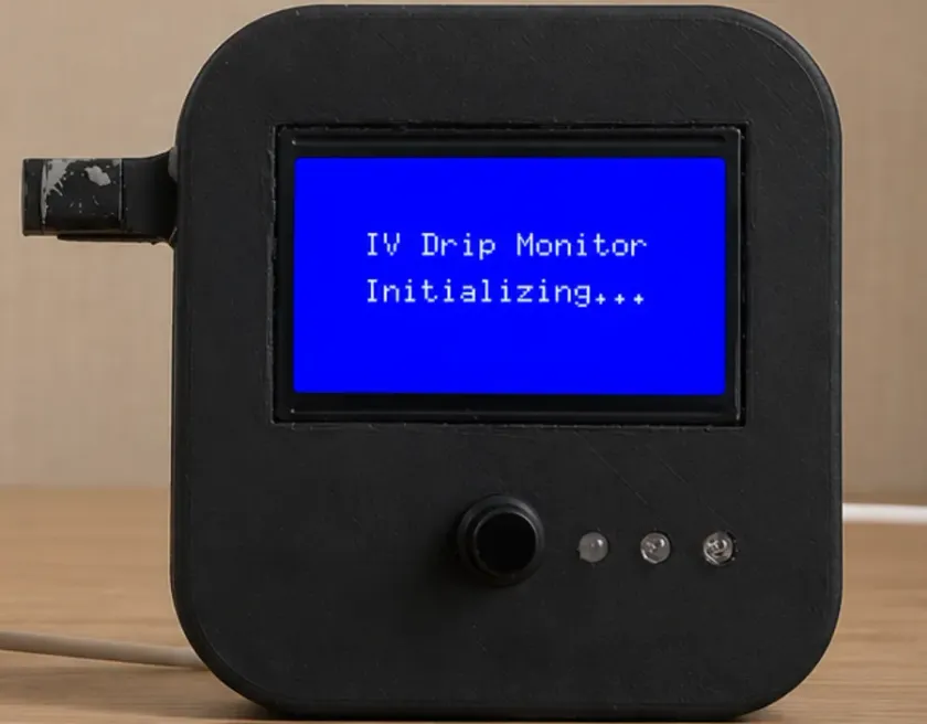 The CareFlow IV drip monitor prototype clipped onto a drip chamber.